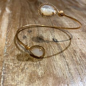 Gold colored bangle bracelet